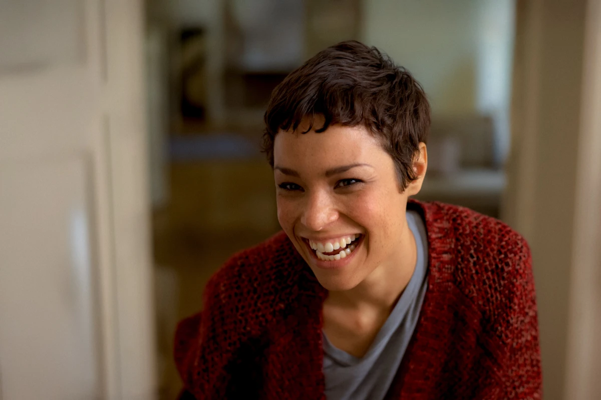 Smiling young person indoors in warm natural light for eBay everyday lifestyle campaign