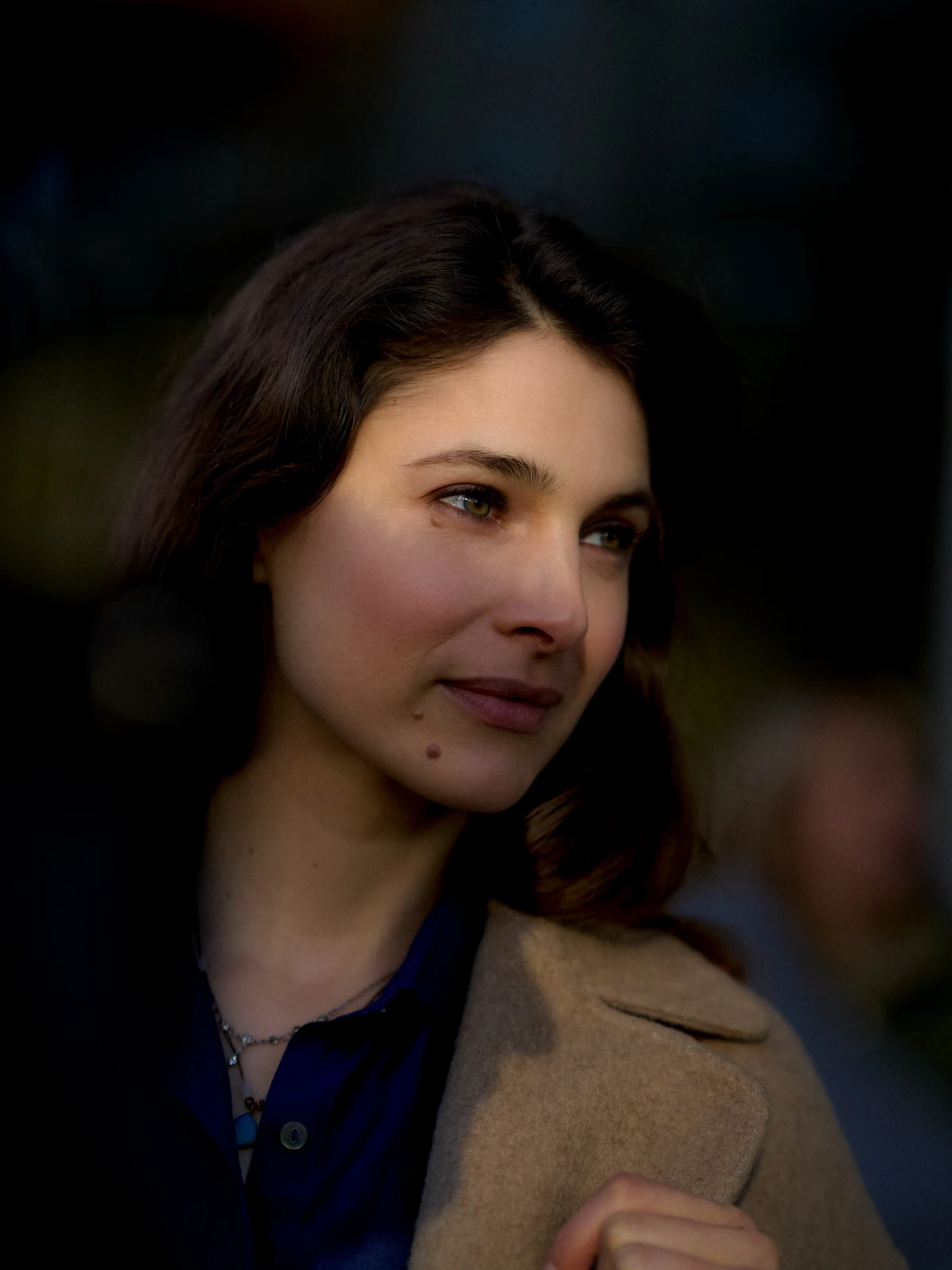 Close portrait of woman outdoors in soft light for Santander banking ad campaign